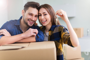 Happy couple with new house keys